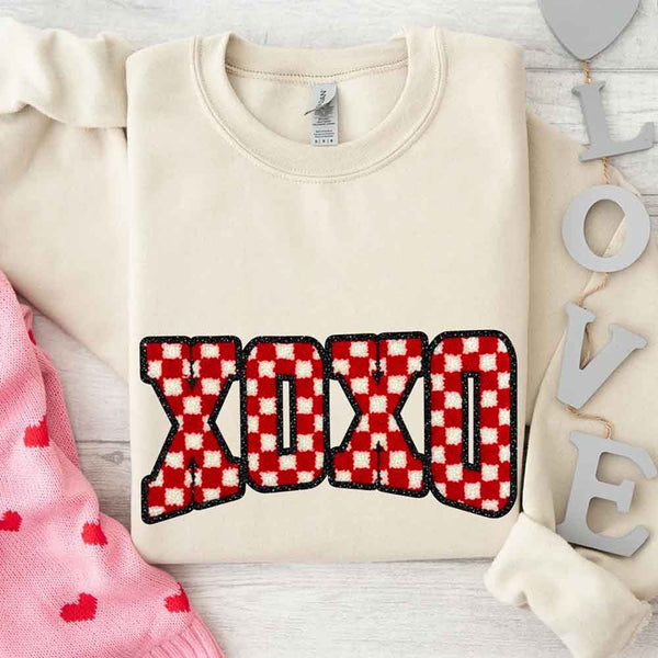 May include a crewneck sweatshirt with an XOXO checkered design featuring a soft, furry-style printed texture.