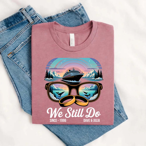 May include a personalized couple’s t-shirt with the phrase “Alaska Adventure We Still Do,” featuring travel-themed graphics, perfect for anniversaries and outdoor-loving partners.