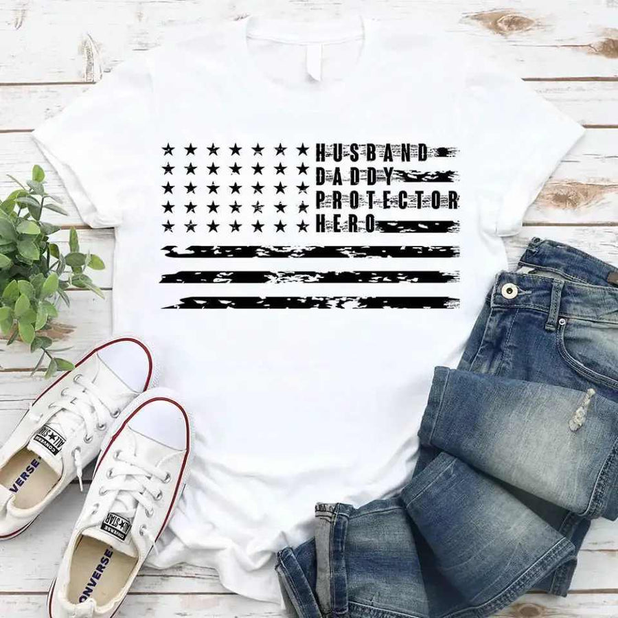 White patriotic Father’s Day t-shirt with American flag design and words husband, daddy, protector, hero