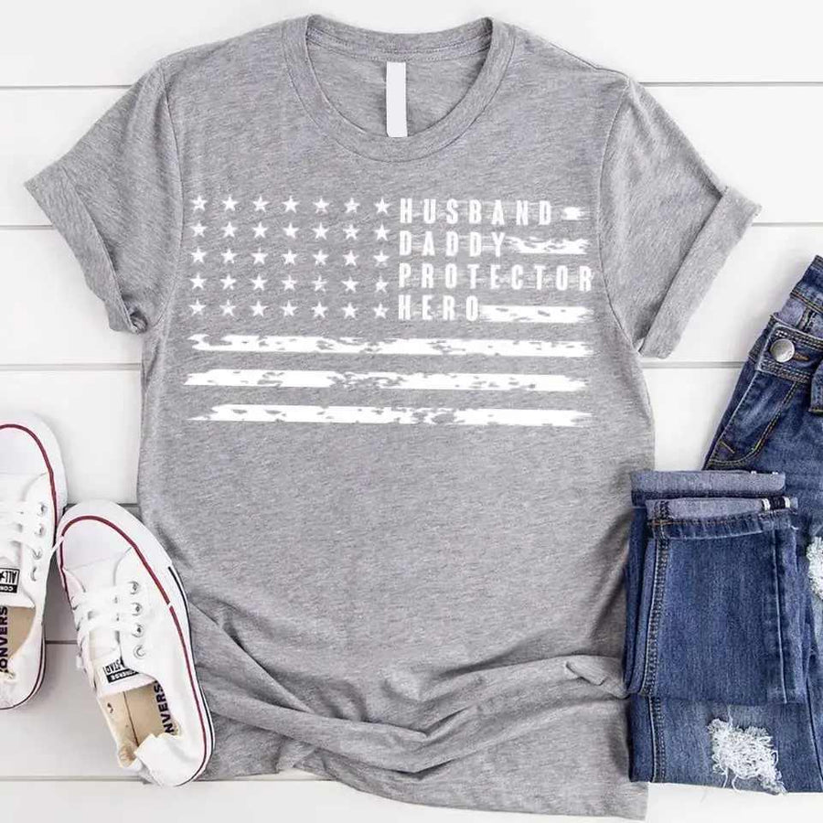 Gray Father's Day t-shirt with distressed American flag and 'Husband Daddy Protector Hero' text.