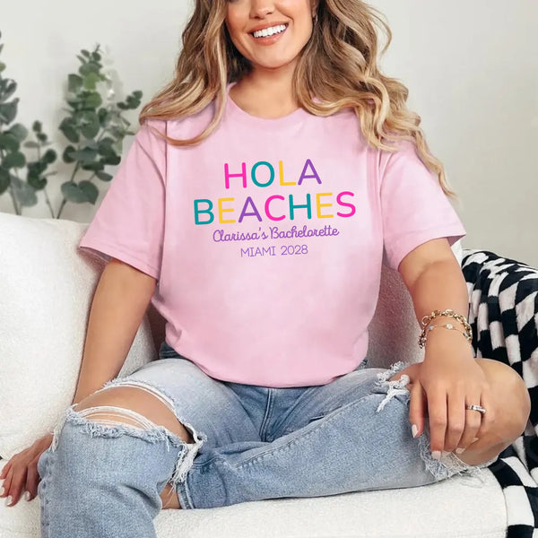 May include Pink colorful “Bride Tribe” beach bachelorette T-shirts worn by a group of women, vibrant summer tones, seaside backdrop, fun party vibe, coordinated bridal crew outfits celebrating together!