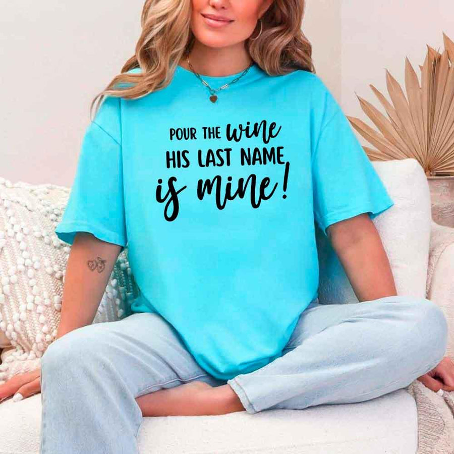 May include Turquoise Bachelorette Party Shirt with "Pour The Wine His Last Name Is Mine" T-Shirt design, perfect for bridal celebrations, fun nights, and making a statement!