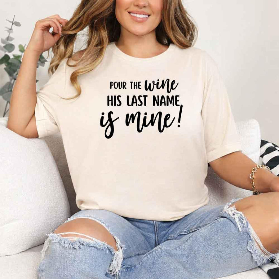 May include Cream Bachelorette Party Shirt with "Pour The Wine His Last Name Is Mine" T-Shirt design, perfect for bridal celebrations, fun nights, and making a statement!
