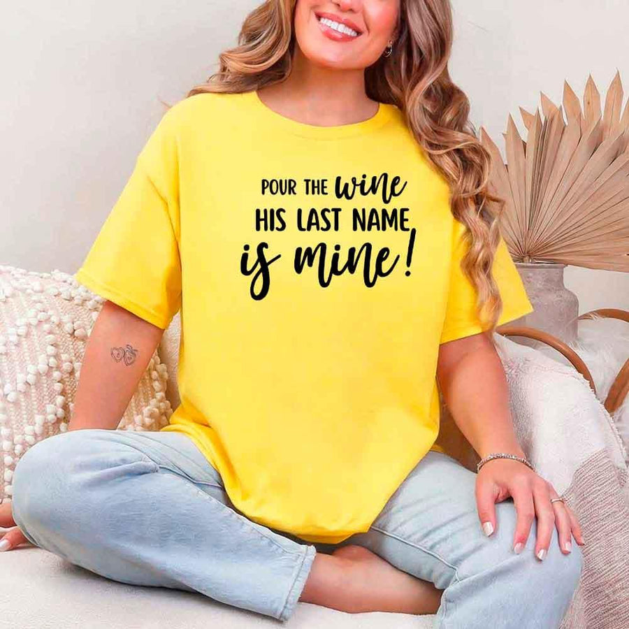 May include Daisy Bachelorette Party Shirt with "Pour The Wine His Last Name Is Mine" T-Shirt design, perfect for bridal celebrations, fun nights, and making a statement!
