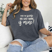 May include Dark Heather Bachelorette Party Shirt with "Pour The Wine His Last Name Is Mine" T-Shirt design, perfect for bridal celebrations, fun nights, and making a statement!
