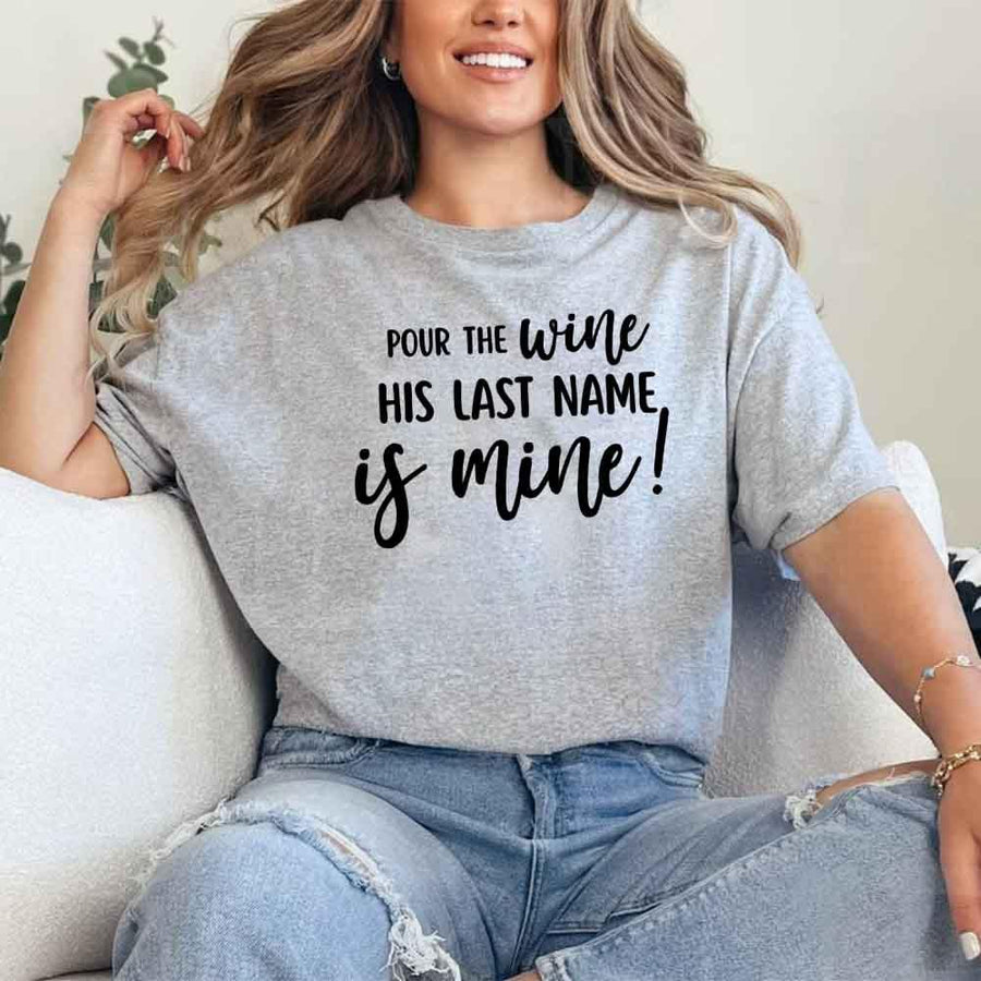 May include Grey Bachelorette Party Shirt with "Pour The Wine His Last Name Is Mine" T-Shirt design, perfect for bridal celebrations, fun nights, and making a statement!
