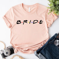 Peach graphic T-shirt with bold text reading “Bride,”