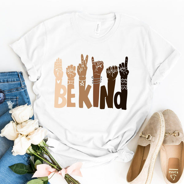 May include a graphic design featuring the phrase “BE KIND,” with each letter creatively formed by illustrated hands making various sign language gestures in different skin tones, symbolizing kindness, inclusion, and diversity.