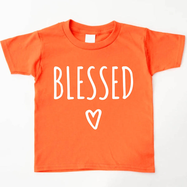 May include parent and child wearing an orange Blessed Parent and Mini matching t-shirts.
