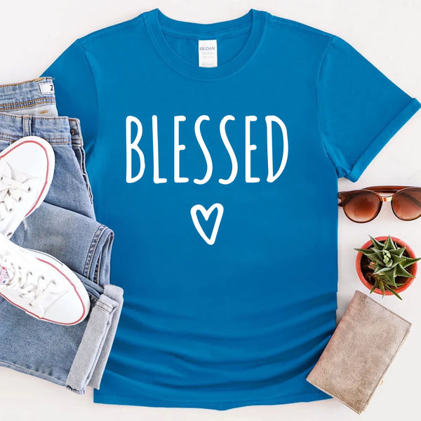 May include parent and child wearing a sapphire turquoise Blessed Parent and Mini matching t-shirts.
