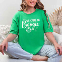 May include an Irish Green retro-style graphic tee with bold disco lettering reading “Boogie With Me, I’m The Bride To Be,” featuring playful fonts and festive design elements!