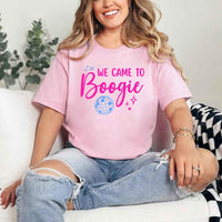 May include a Pink retro-style graphic tee with bold disco lettering reading “Boogie With Me, I’m The Bride To Be,” featuring playful fonts and festive design elements!