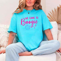 May include a Turquoise retro-style graphic tee with bold disco lettering reading “Boogie With Me, I’m The Bride To Be,” featuring playful fonts and festive design elements!
