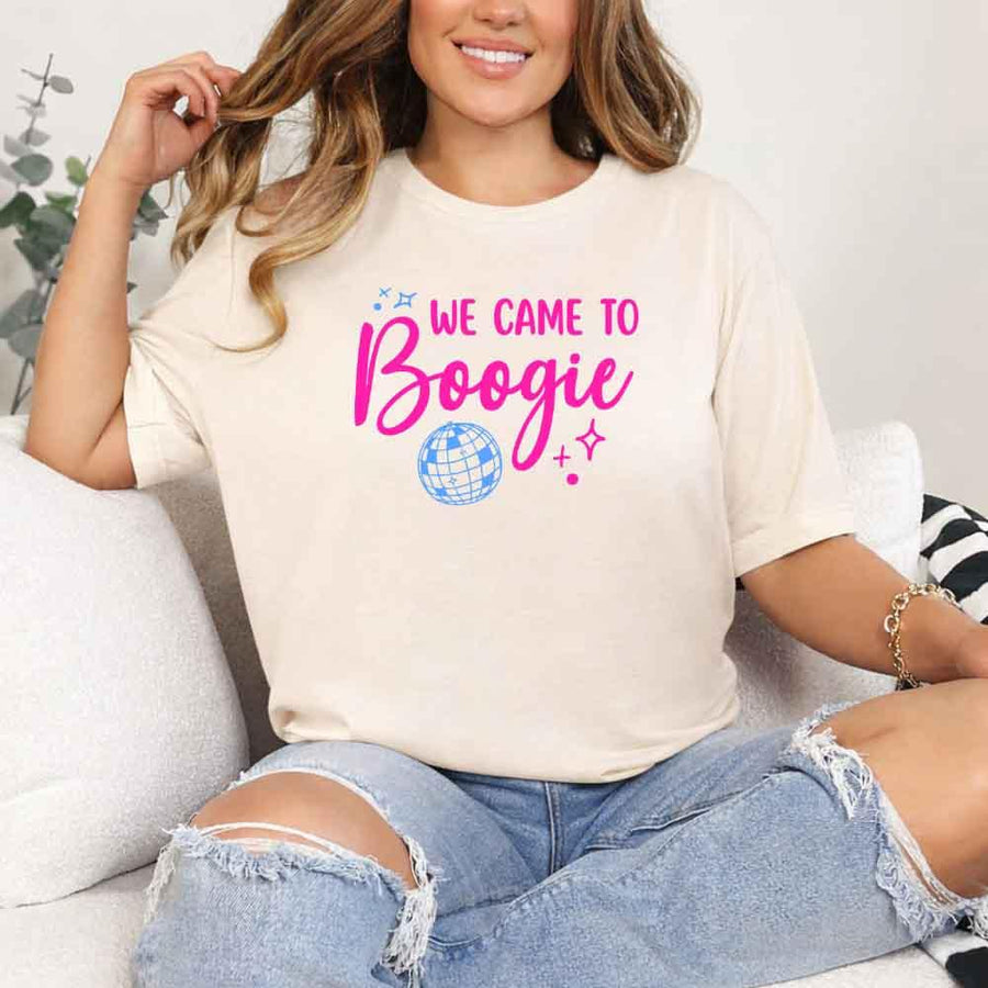May include a Soft Cream retro-style graphic tee with bold disco lettering reading “Boogie With Me, I’m The Bride To Be,” featuring playful fonts and festive design elements!