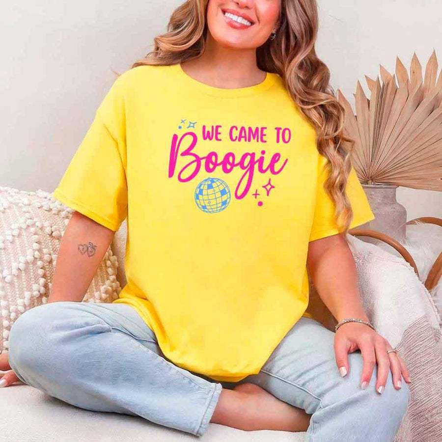 May include a Daisy retro-style graphic tee with bold disco lettering reading “Boogie With Me, I’m The Bride To Be,” featuring playful fonts and festive design elements!
