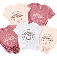 May include camp themed Bachelorette t shirts with fun outdoor slogans cozy vibes bridal squad outfits perfect for camping trip celebrations and girls getaway!