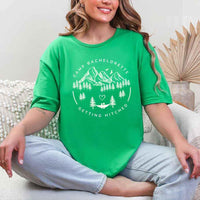 May include Irish Green camp themed Bachelorette t shirts with fun outdoor slogans cozy vibes bridal squad outfits perfect for camping trip celebrations and girls getaway!