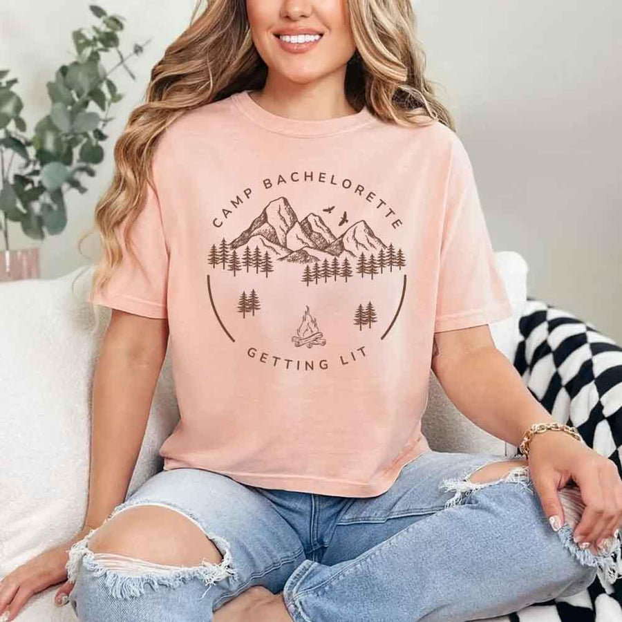 May include Peach camp themed Bachelorette t shirts with fun outdoor slogans cozy vibes bridal squad outfits perfect for camping trip celebrations and girls getaway!