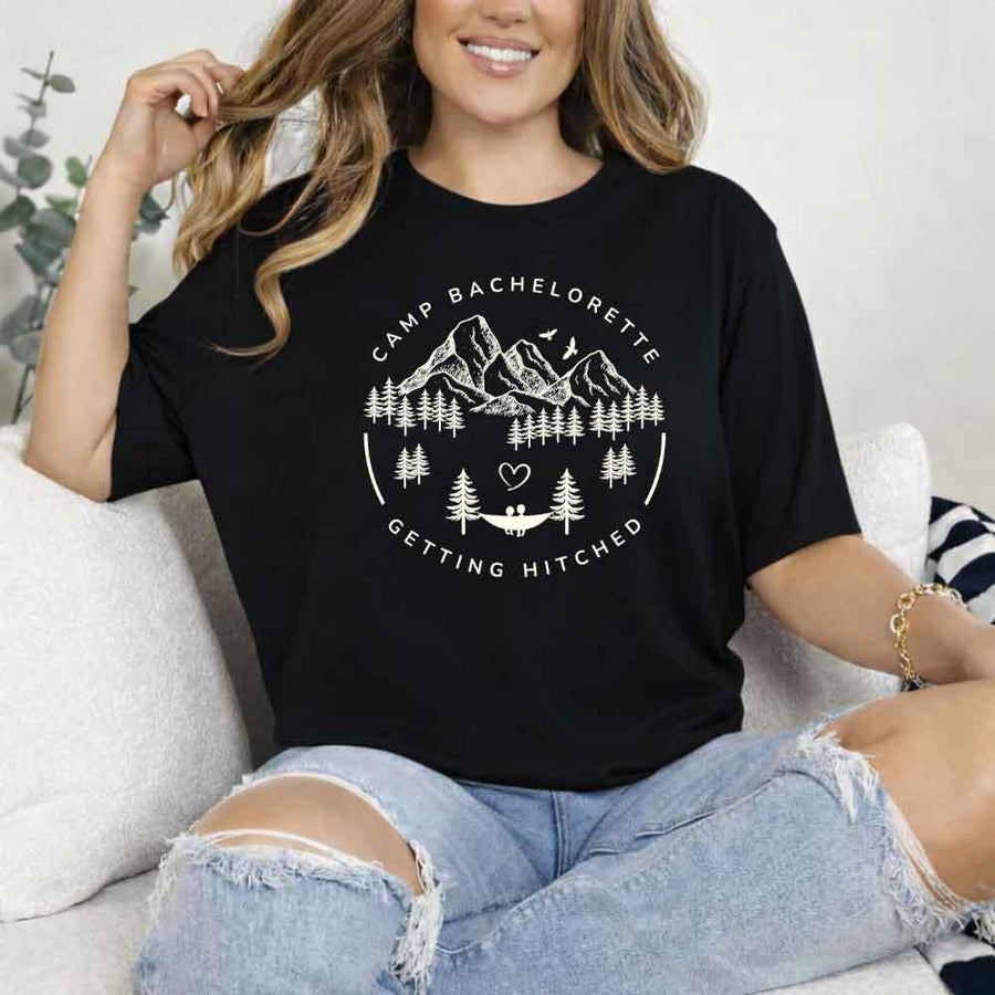 May include Black camp themed Bachelorette t shirts with fun outdoor slogans cozy vibes bridal squad outfits perfect for camping trip celebrations and girls getaway!