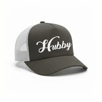 May include an embroidered trucker hat featuring the word “Hubby” stitched in clean, classic lettering on the front panel, designed with a structured crown and breathable mesh back for a timeless wedding or anniversary accessory.
