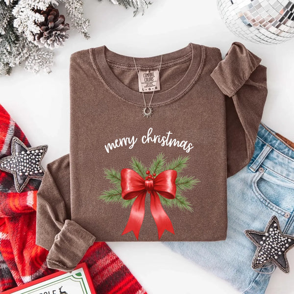 May include a Comfort Colors T-shirt featuring a Christmas bow graphic in coquette aesthetic style with soft vintage tones.