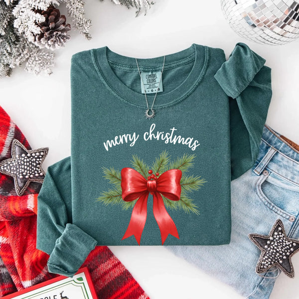 May include a Comfort Colors T-shirt featuring a Christmas bow graphic in coquette aesthetic style with soft vintage tones.