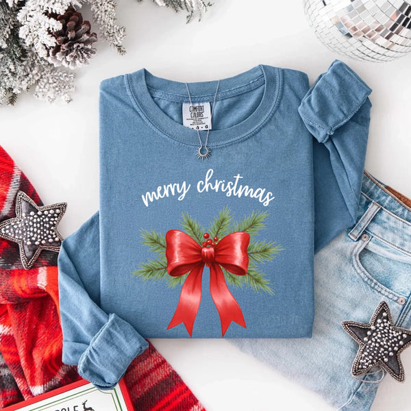 May include a Comfort Colors T-shirt featuring a Christmas bow graphic in coquette aesthetic style with soft vintage tones.