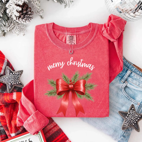 May include a Comfort Colors T-shirt featuring a Christmas bow graphic in coquette aesthetic style with soft vintage tones.