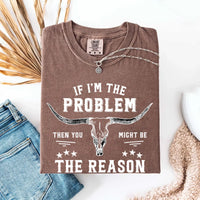 May include a Comfort Colors unisex Western shirt with “If I’m The Problem Then You Might Be The Reason” text, styled with vintage country flair.