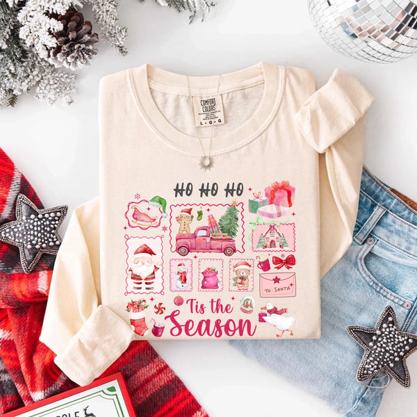 May include a Comfort Colors long sleeve unisex Christmas shirt with “Ho Ho Ho Tis The Season” text design in festive holiday style.