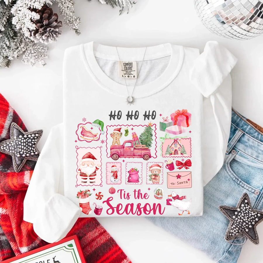 May include a Comfort Colors long sleeve unisex Christmas shirt with “Ho Ho Ho Tis The Season” text design in festive holiday style.