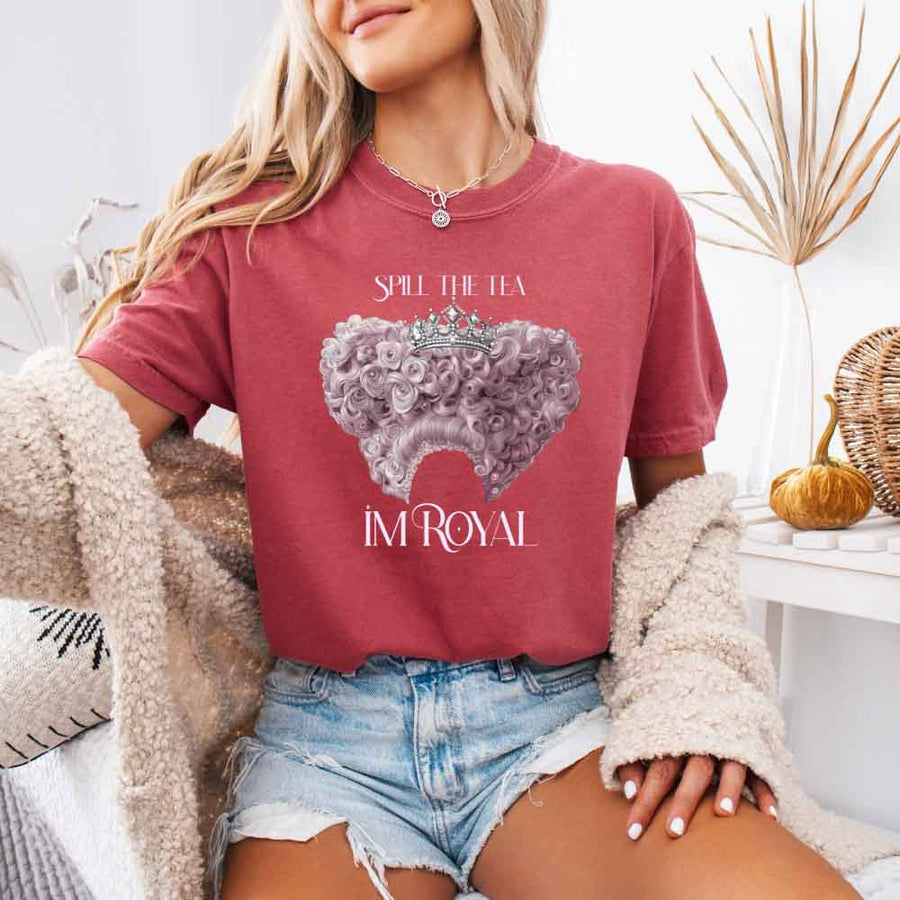 May include a person wearing a Crimson  Comfort Colors Spill the Tea I’m Royal T-Shirt featuring regency gossip inspired graphic and relaxed fit.