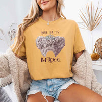 May include a person wearing a Mustard Comfort Colors Spill the Tea I’m Royal T-Shirt featuring regency gossip inspired graphic and relaxed fit.