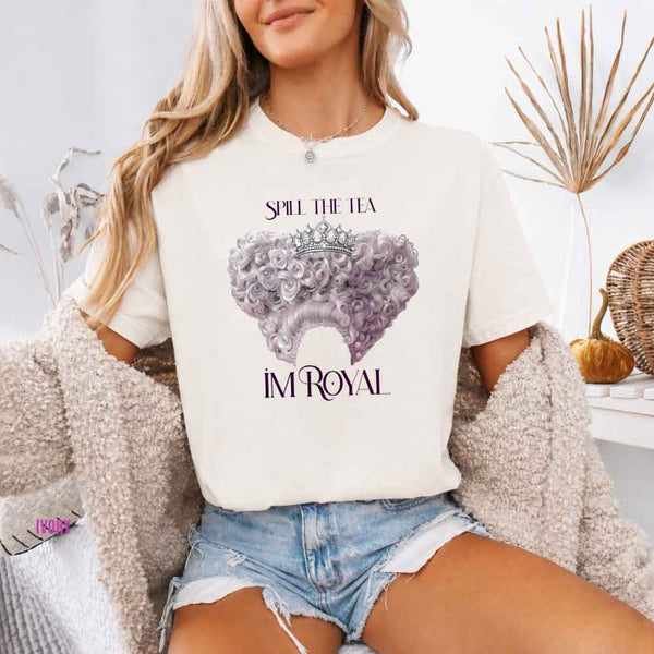 May include a person wearing a Ivory Comfort Colors Spill the Tea I’m Royal T-Shirt featuring regency gossip inspired graphic and relaxed fit.