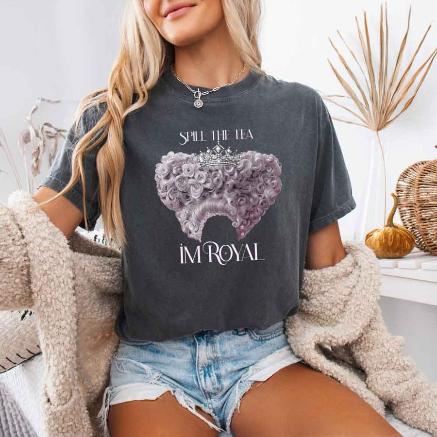 May include a person wearing a Pepper Comfort Colors Spill the Tea I’m Royal T-Shirt featuring regency gossip inspired graphic and relaxed fit.