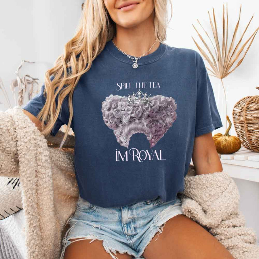 May include a person wearing a Denim Comfort Colors Spill the Tea I’m Royal T-Shirt featuring regency gossip inspired graphic and relaxed fit.
