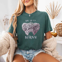 May include a person wearing a Blue Spruce Comfort Colors Spill the Tea I’m Royal T-Shirt featuring regency gossip inspired graphic and relaxed fit.