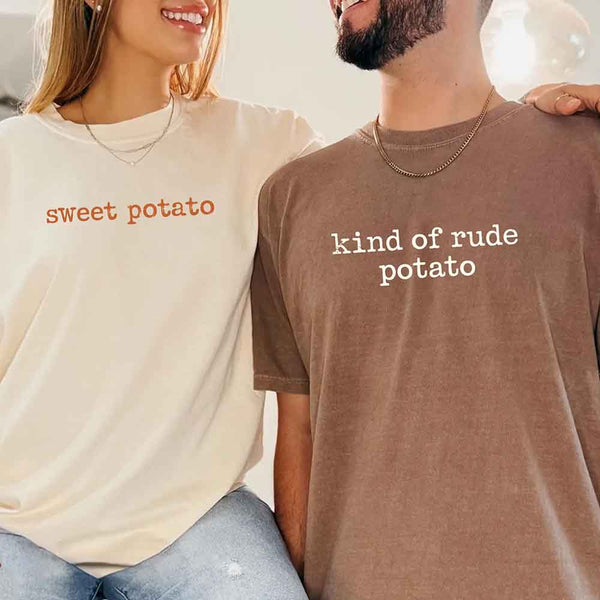 May include a pair of matching fall-themed couple t-shirts from Comfort Colors featuring playful “Sweet Potato” and “Rude Potato” designs. The shirts are styled with humorous graphics or text in warm autumn tones, perfect for couples celebrating the season with a lighthearted touch.