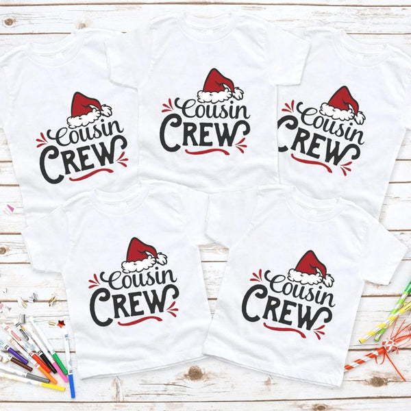 May include a matching family Christmas t-shirt featuring the phrase “Cousin Crew” in festive lettering, often accented with holiday graphics like Santa hats, snowflakes, or Christmas lights. Designed for coordinated family outfits, it conveys a cheerful and playful holiday spirit.