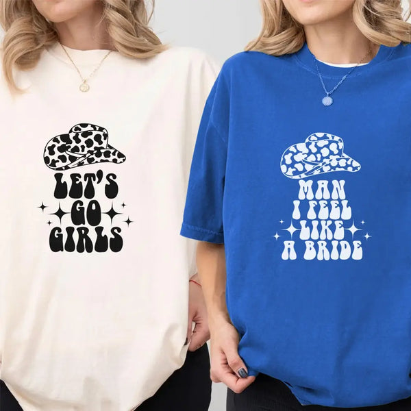 Two people wearing t-shirts with printed text and graphics.