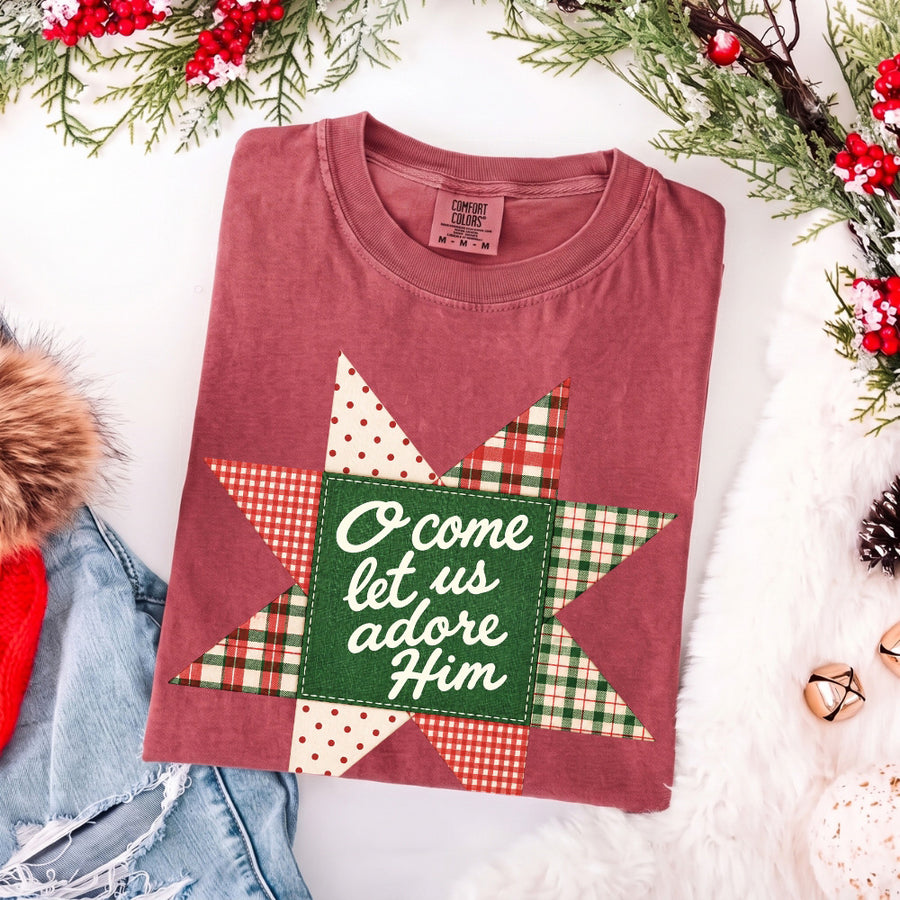 May include an O Come Let Us Adore Him Comfort Colors Christmas T-Shirt featuring a Christian holiday message inspired by a beloved Christmas hymn, designed for church services, family gatherings, worship events, and meaningful seasonal gifting.