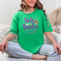 May include Green bridesmaids wearing custom matching beach bachelorette T-shirts, relaxed seaside setting with sand and ocean backdrop, coordinated outfits, smiling and celebrating together outdoors!
