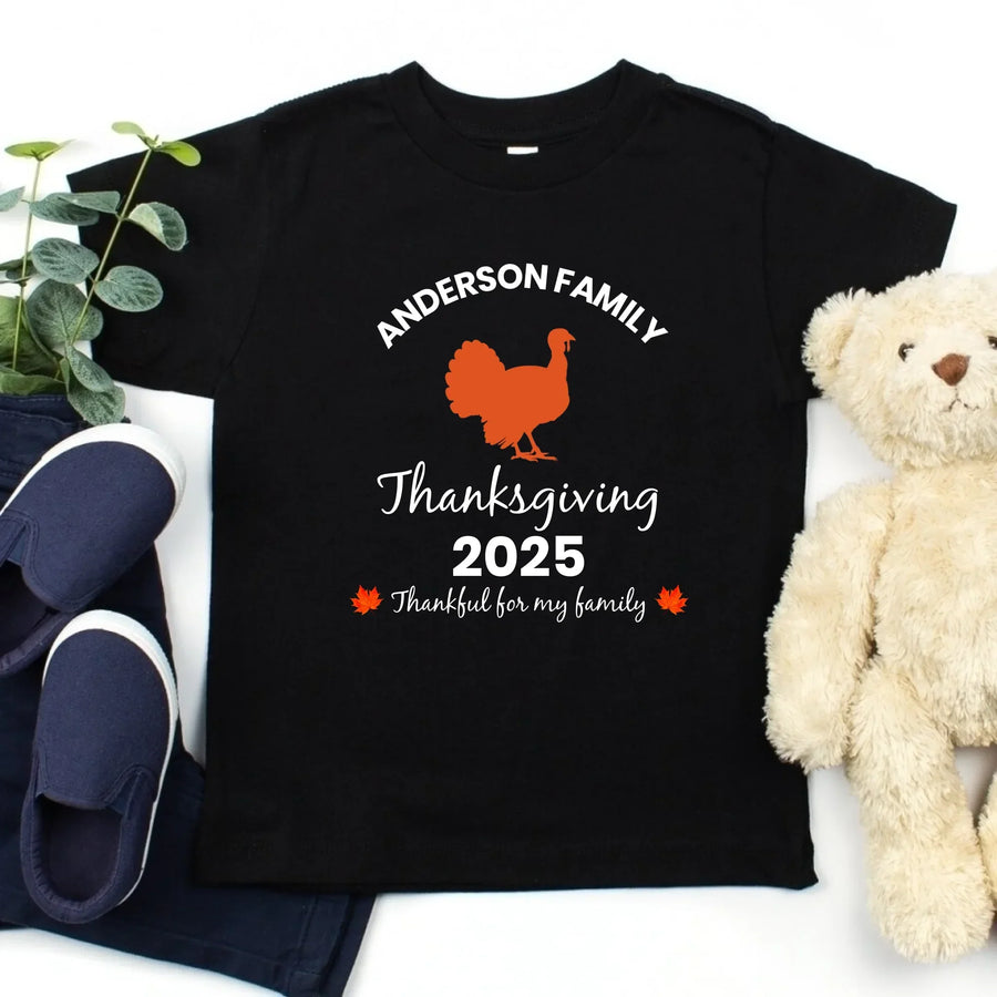 May include matching family t-shirts with a Thankful Fall theme, personalized with individual names, designed for Thanksgiving gatherings.