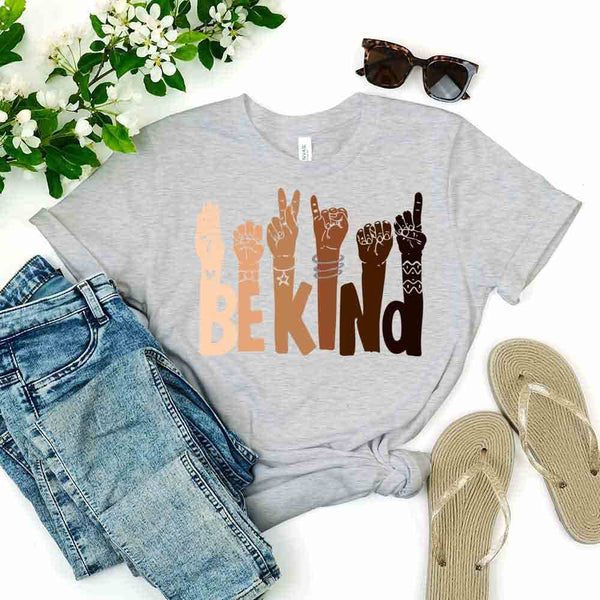 May include a graphic design featuring the phrase “BE KIND,” with each letter creatively formed by illustrated hands making various sign language gestures in different skin tones, symbolizing kindness, inclusion, and diversity.