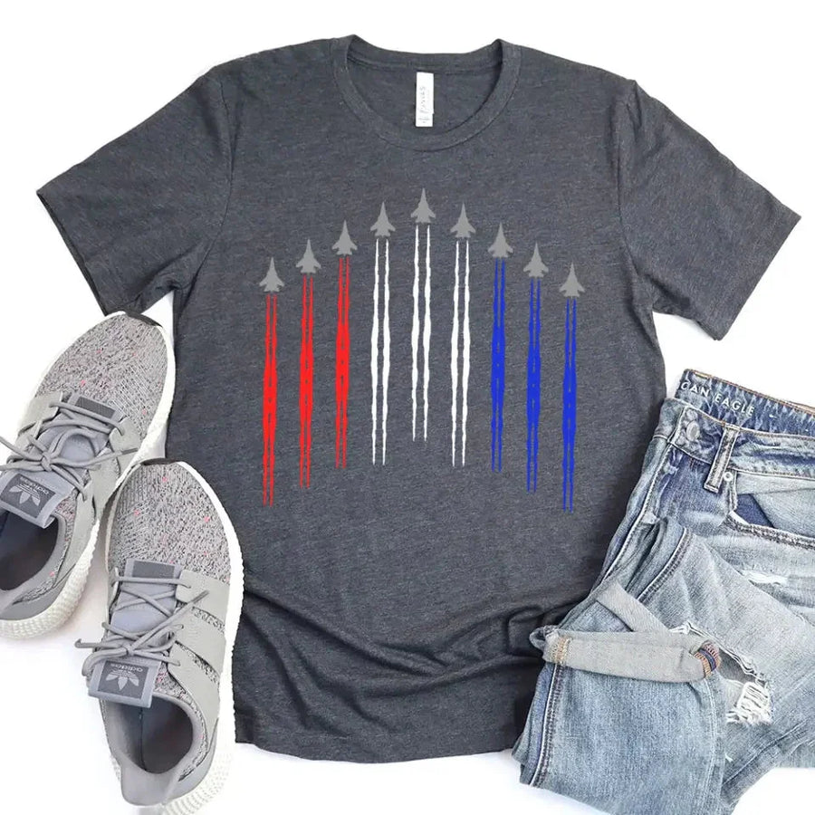 Charcoal t-shirt with red, white, and blue air force jet flyover graphic, styled with jeans and sneakers
