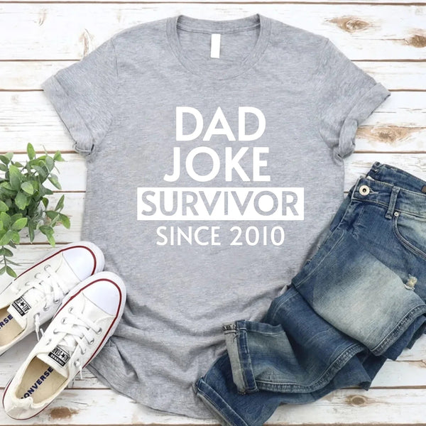 May include a father and family wearing matching t-shirts with a “Dad Jokes” graphic.