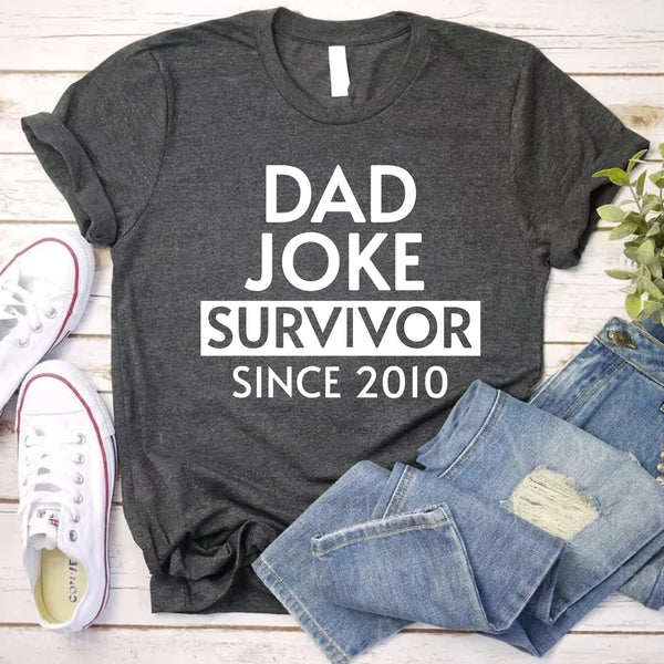 May include a father and family wearing matching t-shirts with a “Dad Jokes” graphic.
