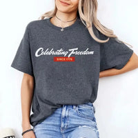 Person wearing a gray t-shirt with 'Celebrating Freedom Since 1776' text on a white background