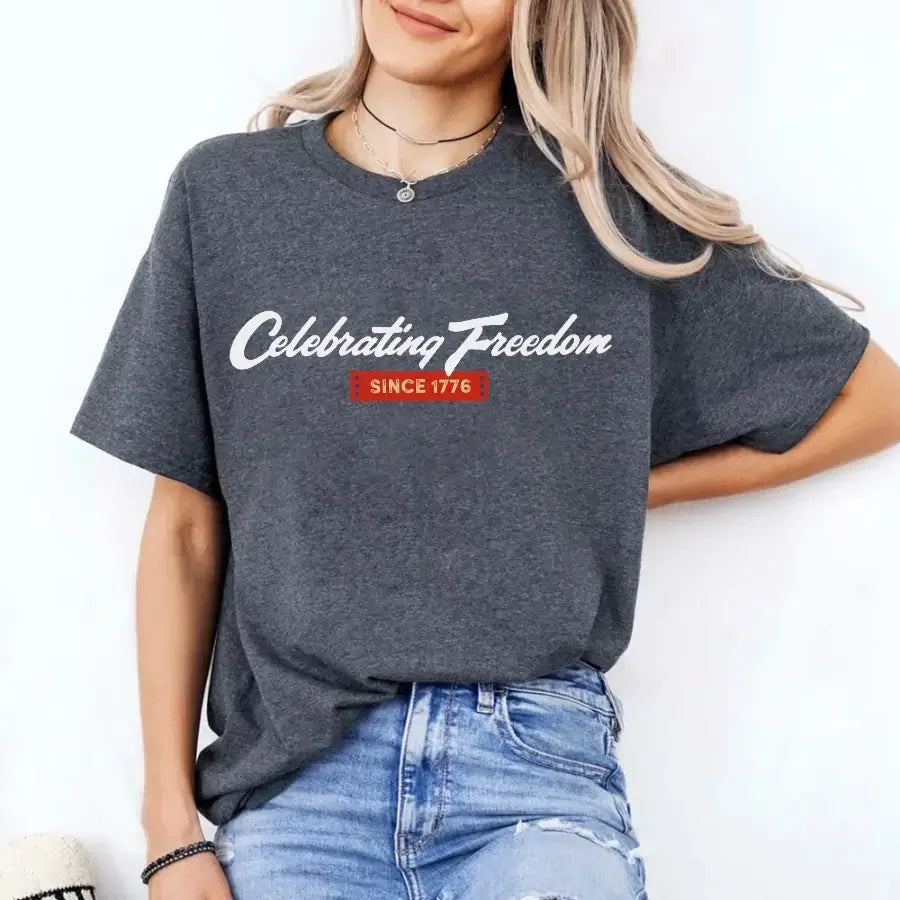 Person wearing a gray t-shirt with 'Celebrating Freedom Since 1776' text on a white background