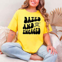 May include Daisy group in colorful tie-dye shirts reading “Dazed & Engaged,” smiling at a bachelorette party, with bride in veil and fun, festive vibe!